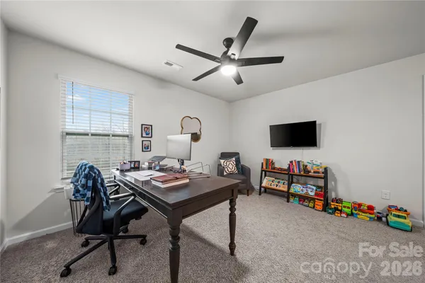 a view of a workspace with furniture