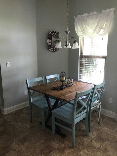 88392 Maybourne Road Yulee, FL 32097 - Photo 16 of 34 a view of a dining room with furniture and window