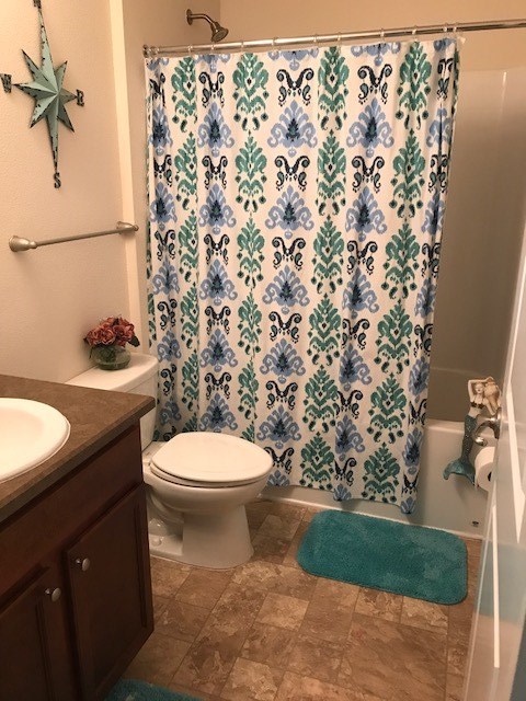 88392 Maybourne Road Yulee, FL 32097 - Photo 20 of 34 a bathroom with a granite countertop toilet and a sink