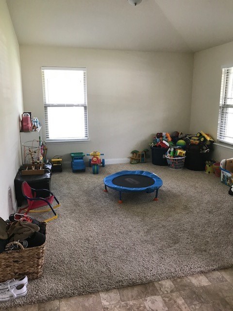 88392 Maybourne Road Yulee, FL 32097 - Photo 22 of 34 a view of a room with gym equipment and a window