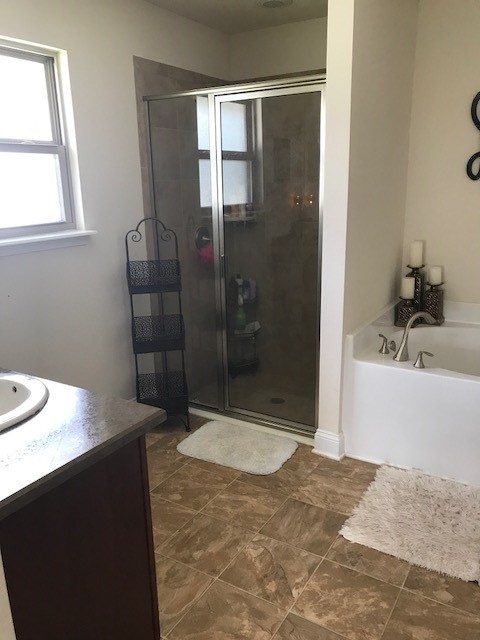 88392 Maybourne Road Yulee, FL 32097 - Photo 26 of 34 a bathroom with a sink and a shower