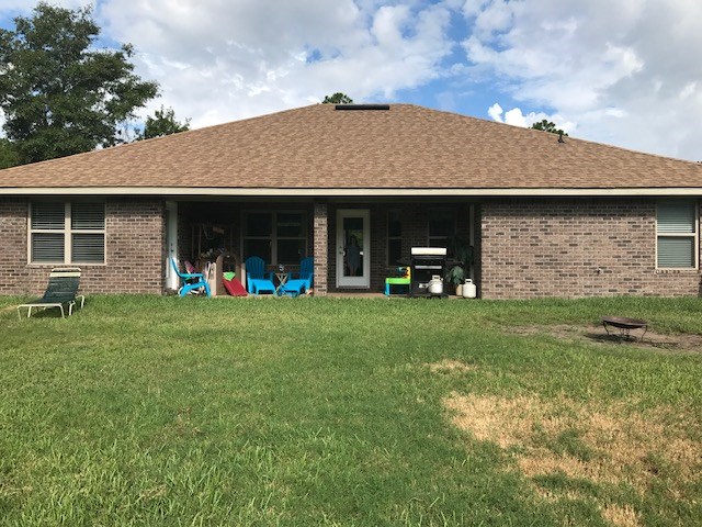 88392 Maybourne Road Yulee, FL 32097 - Photo 33 of 34 a view of a house with a backyard