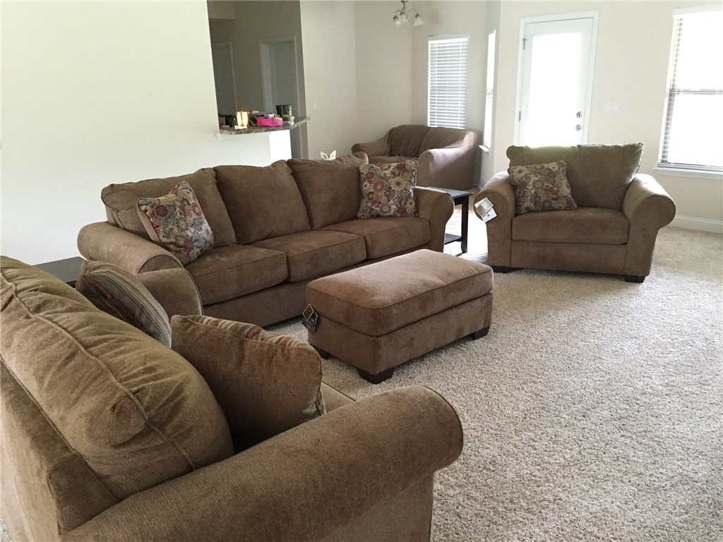 88392 Maybourne Road Yulee, FL 32097 - Photo 6 of 34 a living room with furniture and a couch