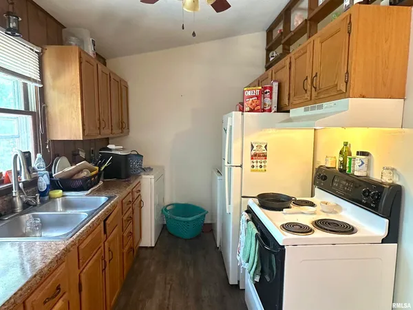 a kitchen that has a sink and a stove