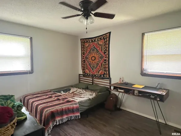 a bedroom with bed and window