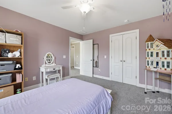 a bedroom with a bed and a cabinets