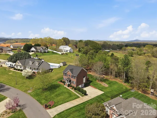 an aerial view of a house with a garden