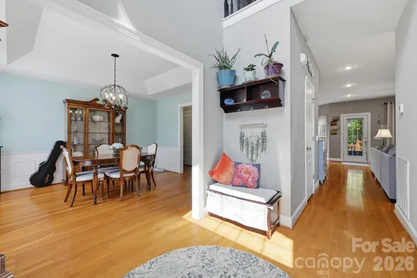 a living room with furniture and a kitchen view
