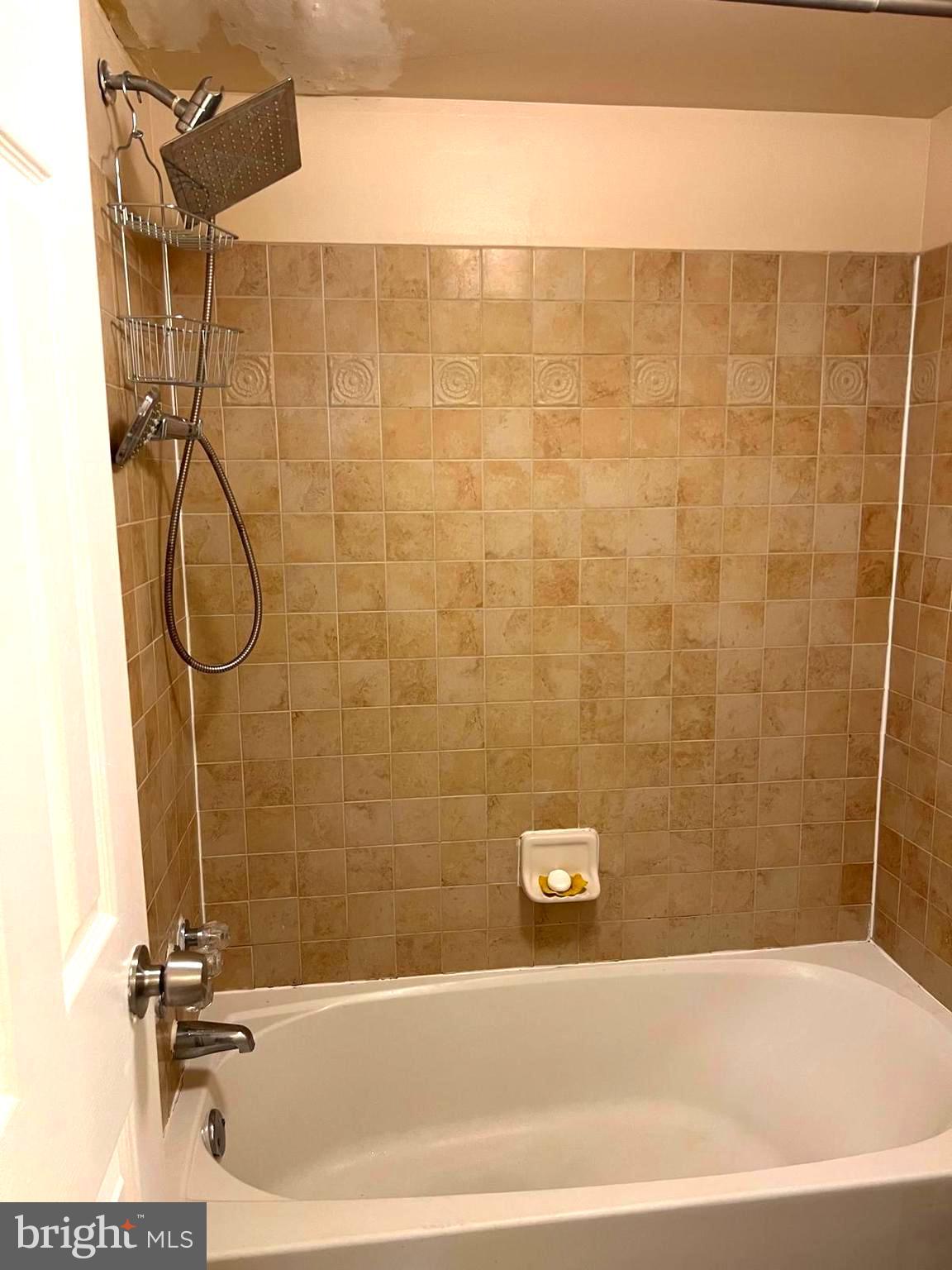 1836 Metzerott Road, Unit 916 Adelphi, MD 20783 - Photo 22 of 42 a bathroom with a bathtub