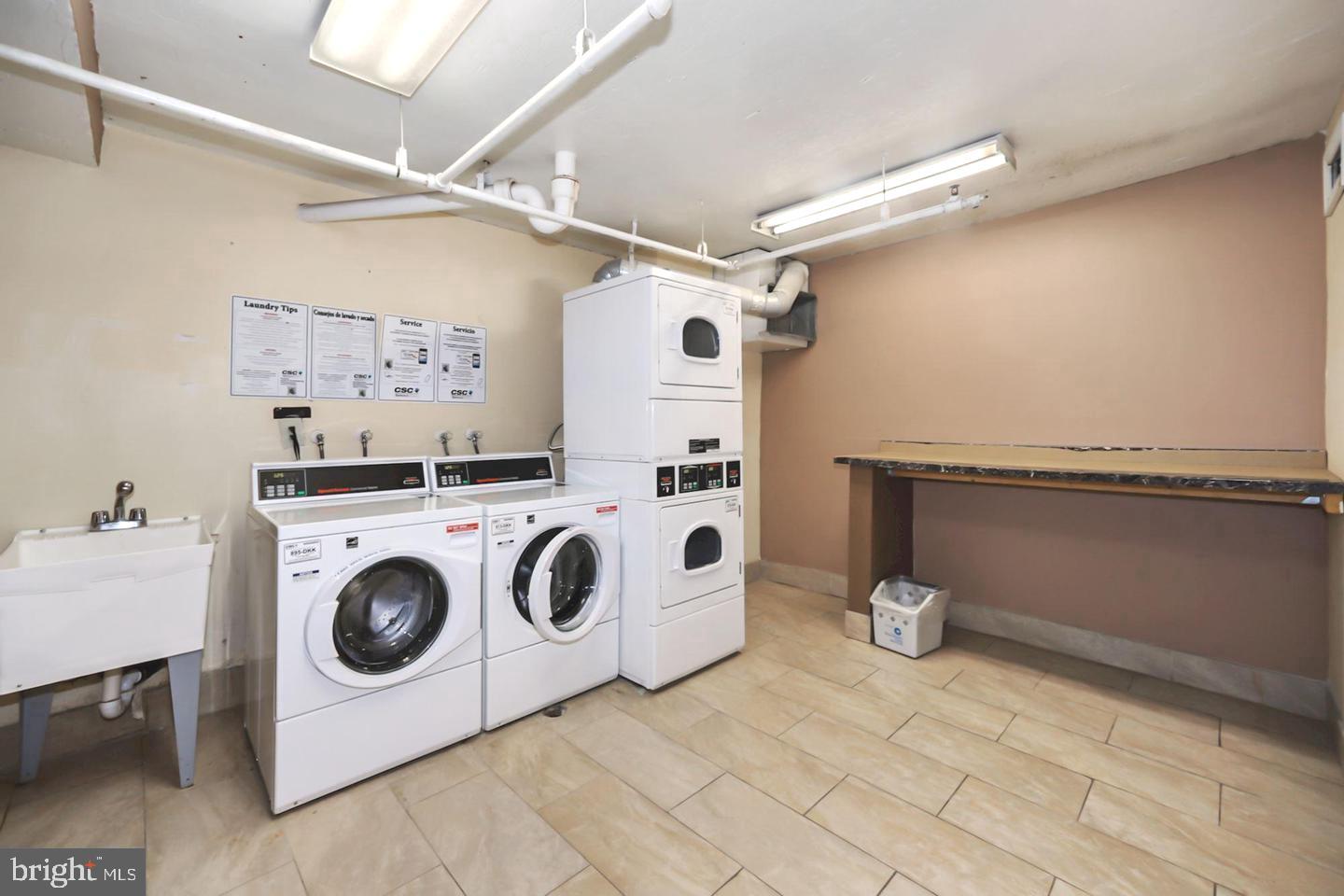 1836 Metzerott Road, Unit 916 Adelphi, MD 20783 - Photo 23 of 42 a utility room with dryer and washer