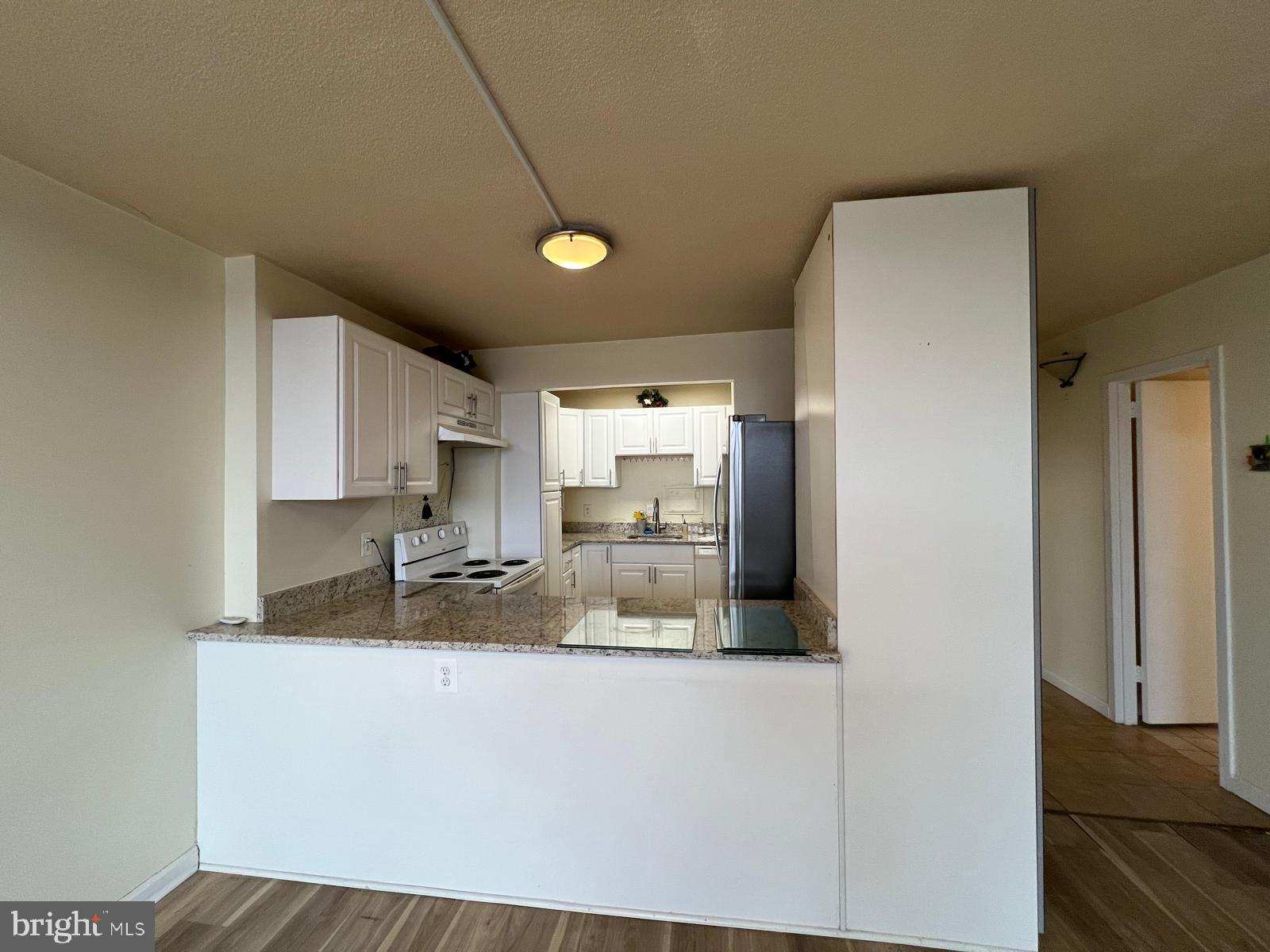 1836 Metzerott Road, Unit 916 Adelphi, MD 20783 - Photo 27 of 29 a kitchen with a sink and cabinets