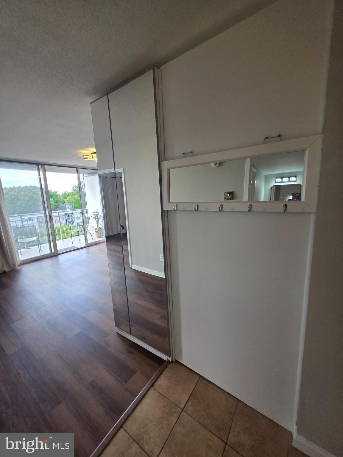 1836 Metzerott Road, Unit 916 Adelphi, MD 20783 - Photo 32 of 42 a view of empty room with wooden floor and fan