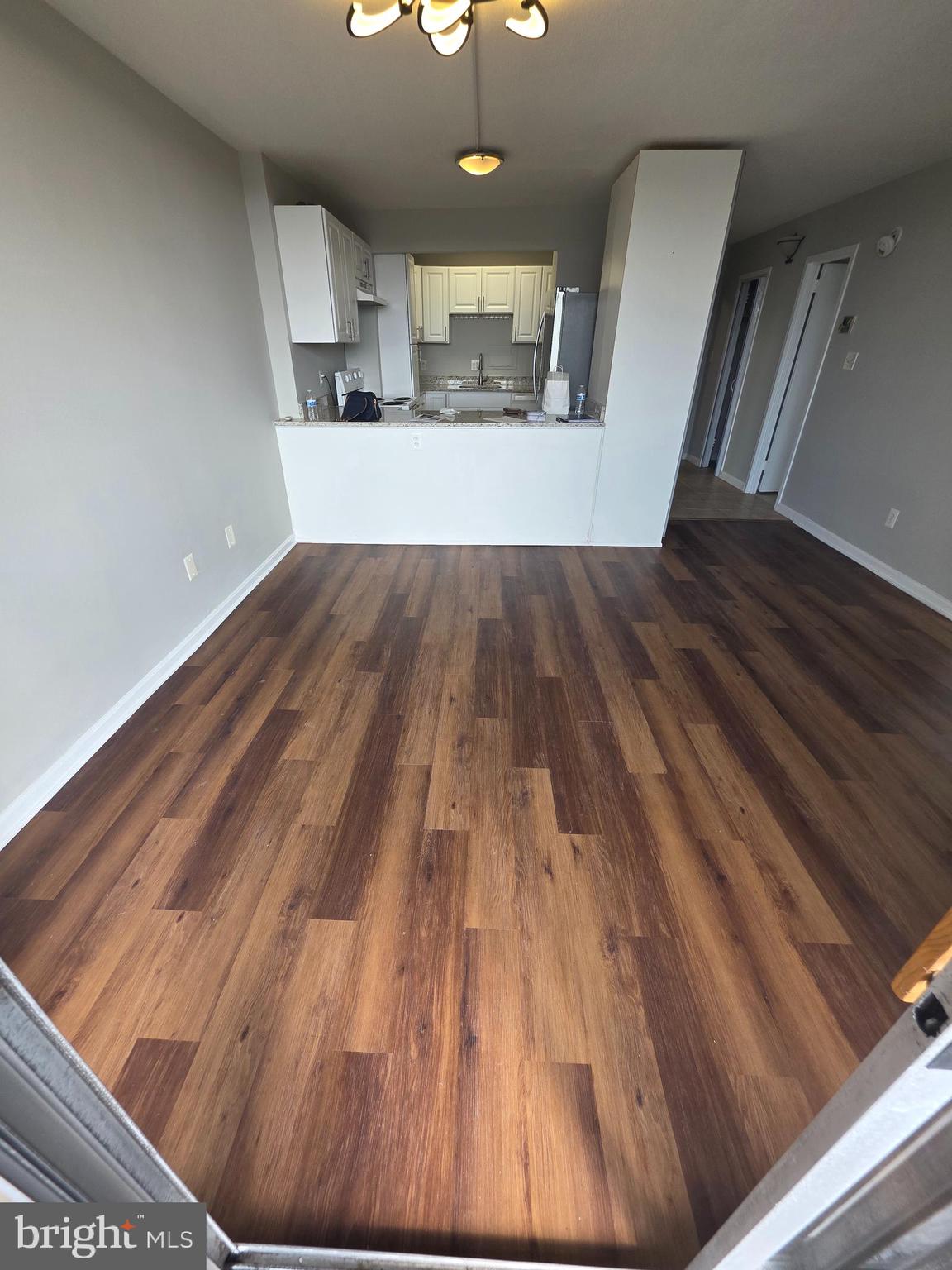 1836 Metzerott Road, Unit 916 Adelphi, MD 20783 - Photo 37 of 42 a view of a living room with a wooden floor