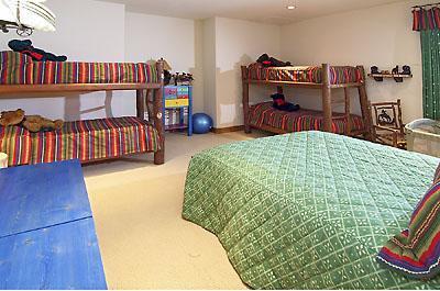 3892 Daybreak Ridge Road Avon, CO 81620 - Photo 14 of 24 a bedroom with a bed and dresser