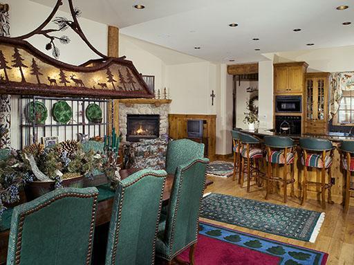 3892 Daybreak Ridge Road Avon, CO 81620 - Photo 4 of 24 a living room with furniture a fireplace a rug and a window