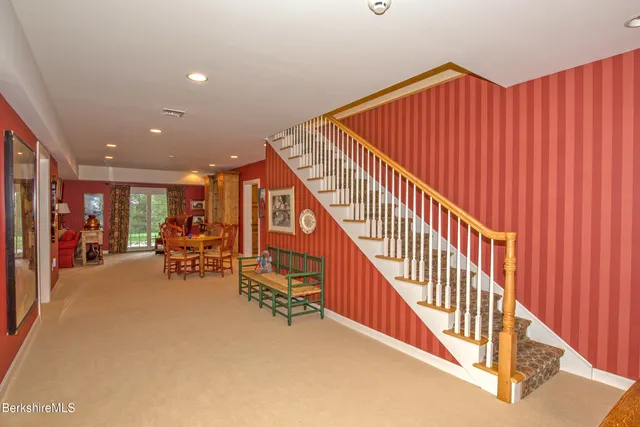 a kitchen with granite countertop a sink and a refrigerator