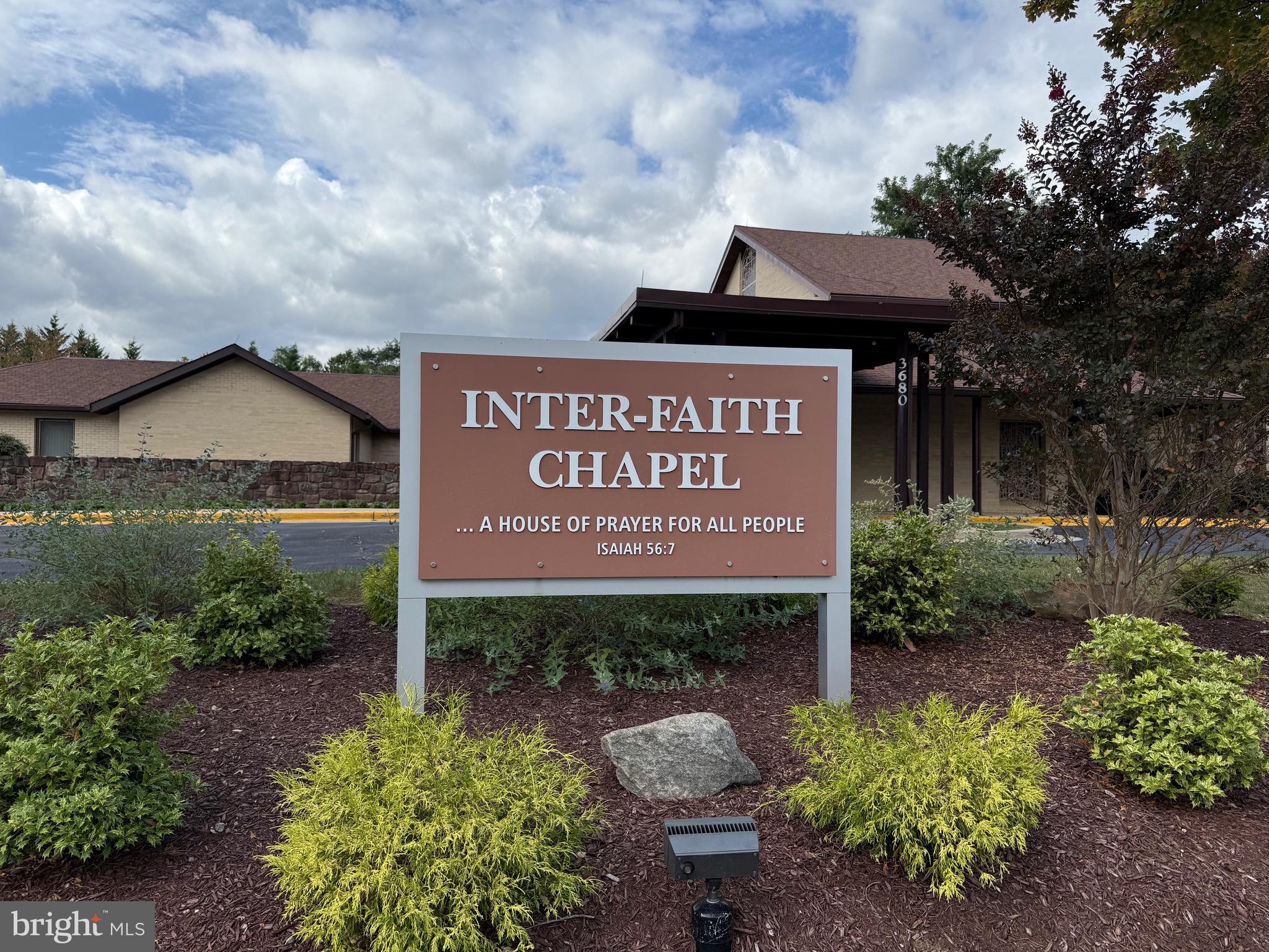 3301 South Leisure World Boulevard, Unit 991H Silver Spring, MD 20906 - Photo 18 of 25 a sign that is sitting in front of flowers