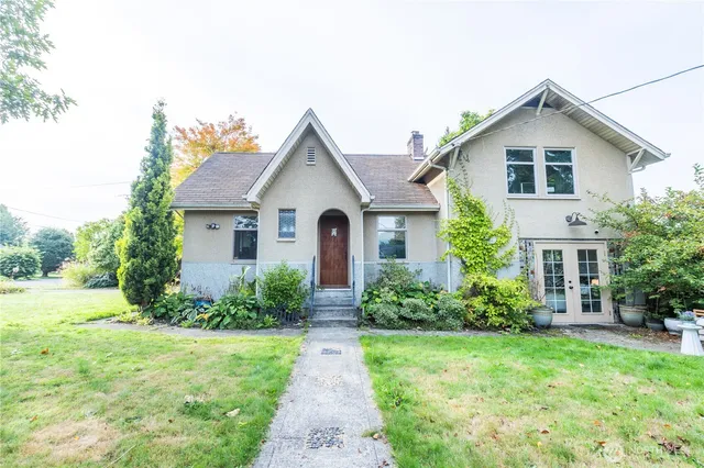 a front view of a house with garden