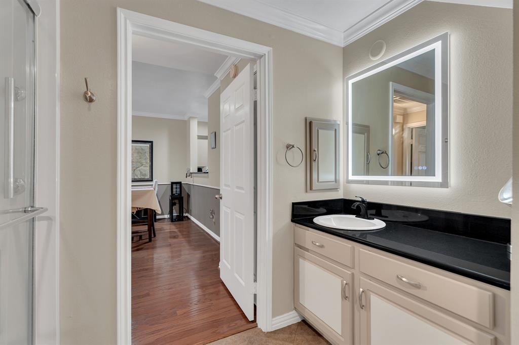 2524 Preston Road, Unit 1205 Plano, TX 75093 - Photo 20 of 31 Bathroom showing granite counters, sink and lighted mirror