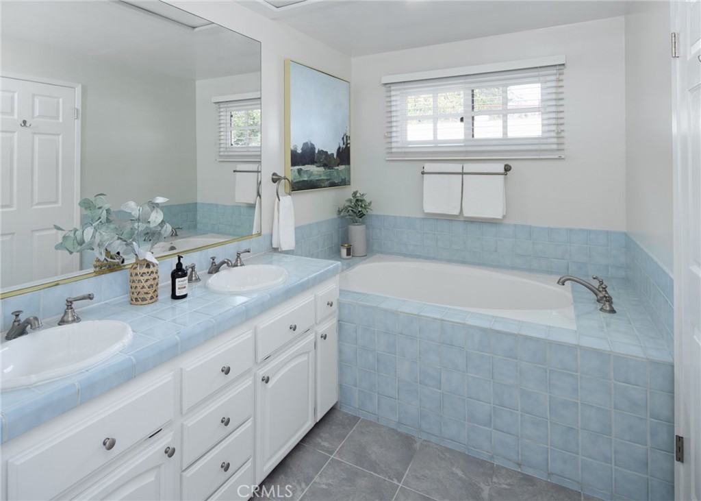 1261 East Maple Avenue El Segundo, CA 90245 - Photo 12 of 26 a spacious bathroom with sinks mirror and a bathtub