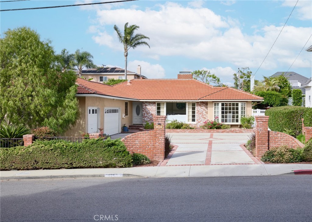 1261 East Maple Avenue El Segundo, CA 90245 - Photo 23 of 26 a front view of a house with yard and green space