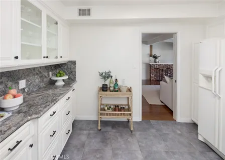 a spacious bathroom with a sink and a window