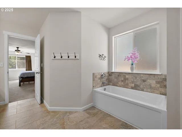 a bathroom with a double vanity sink and mirror