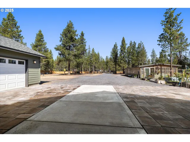 a view of a backyard with sitting area