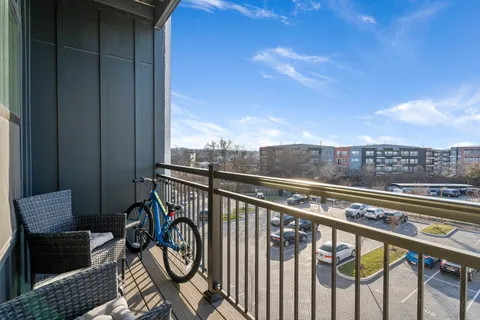 a view of a balcony with furniture