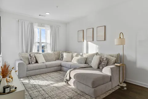 a living room with furniture and a couch