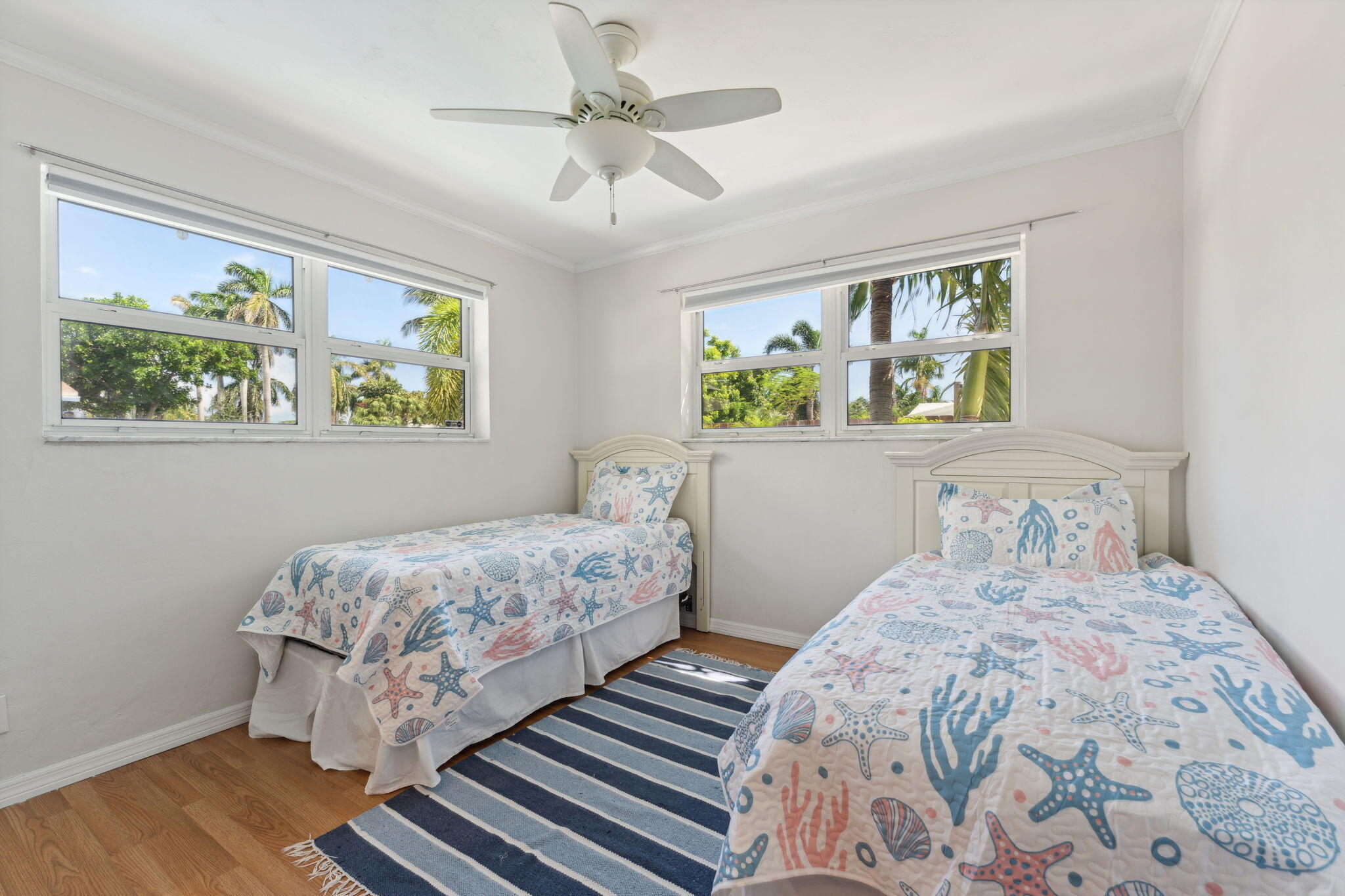 2691 Northeast 18th Street Pompano Beach, FL 33062 - Photo 17 of 34 a bedroom with a large bed and a window
