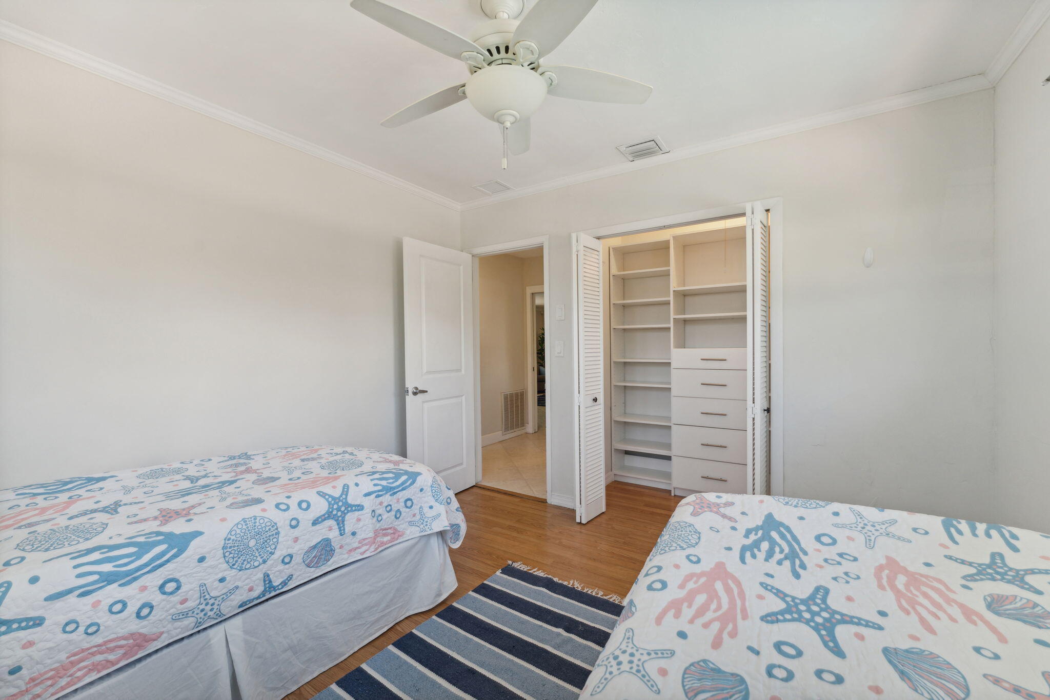 2691 Northeast 18th Street Pompano Beach, FL 33062 - Photo 18 of 34 a bedroom with a bed and a dresser