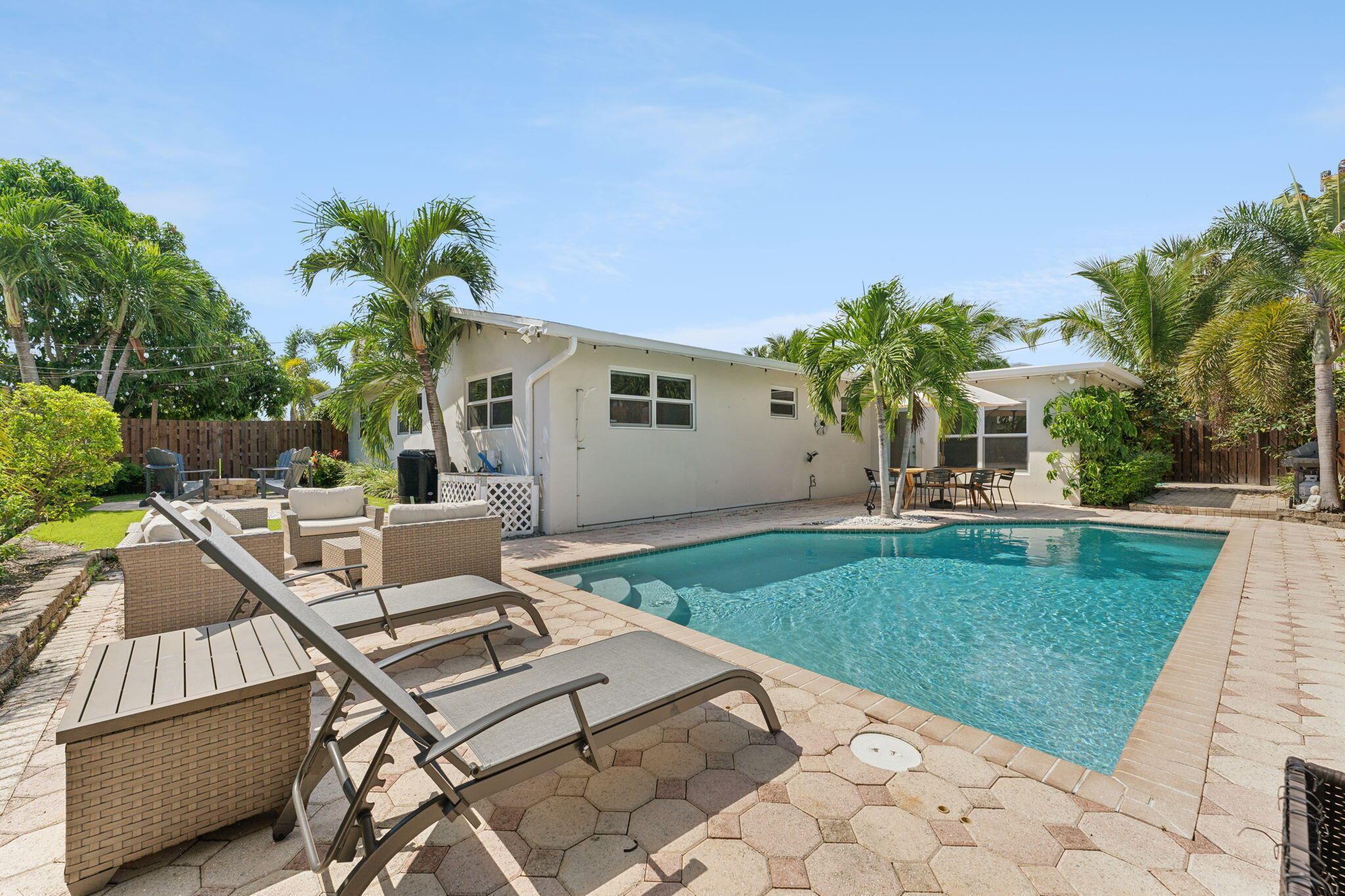 2691 Northeast 18th Street Pompano Beach, FL 33062 - Photo 26 of 34 a view of a patio with a table and chairs