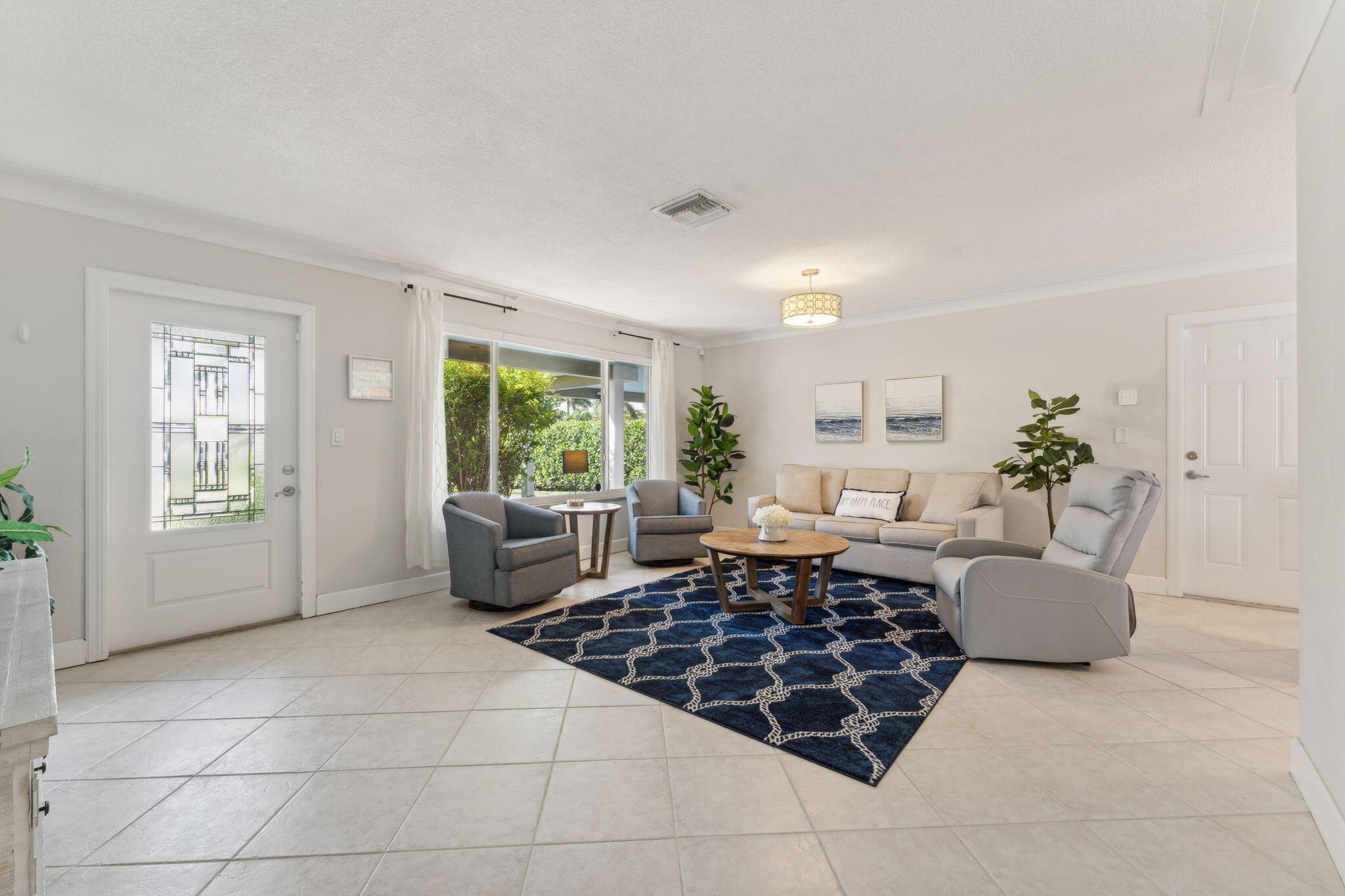 2691 Northeast 18th Street Pompano Beach, FL 33062 - Photo 3 of 34 a living room with furniture and a window