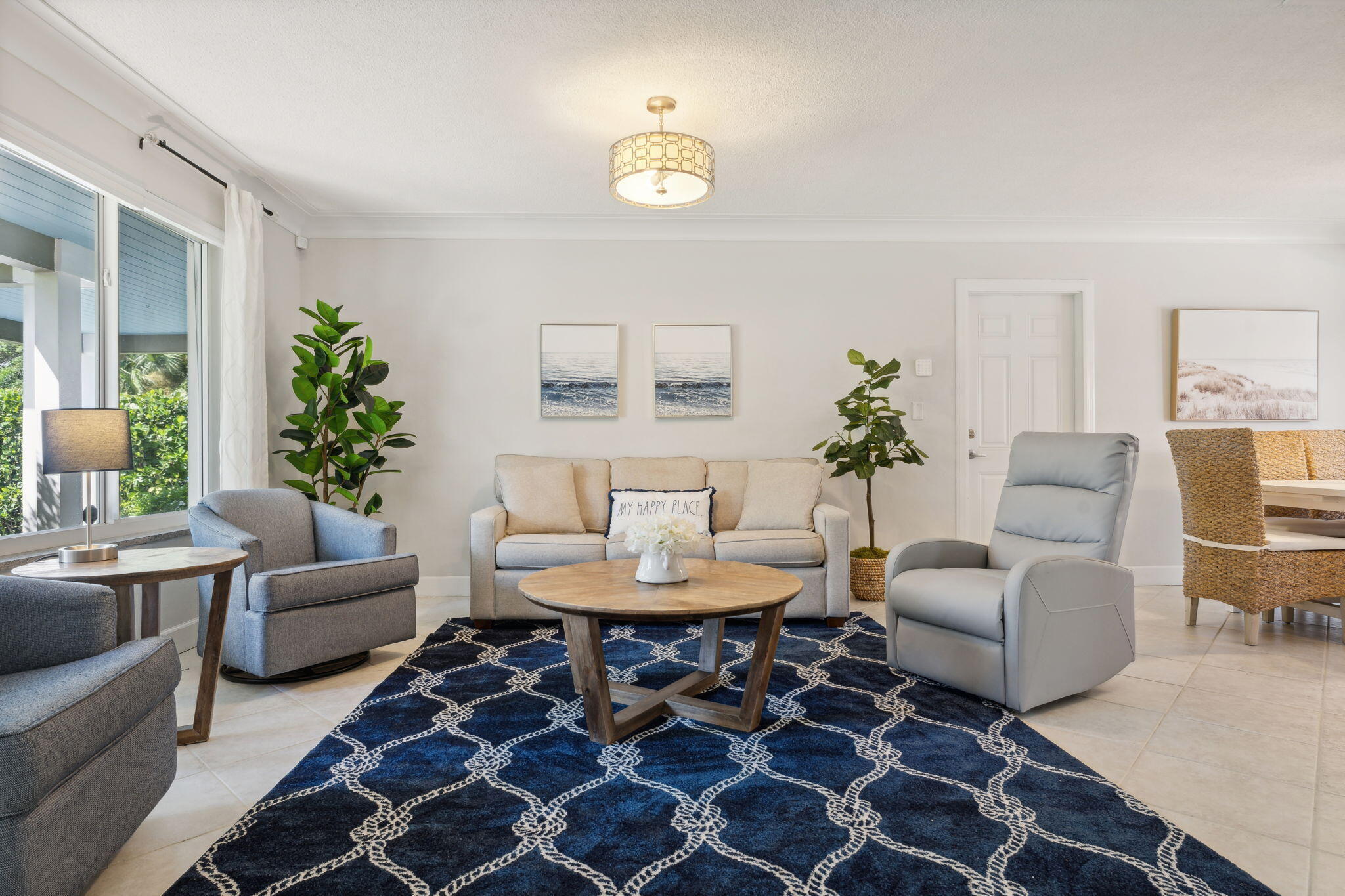 2691 Northeast 18th Street Pompano Beach, FL 33062 - Photo 4 of 34 a living room with furniture and a chandelier