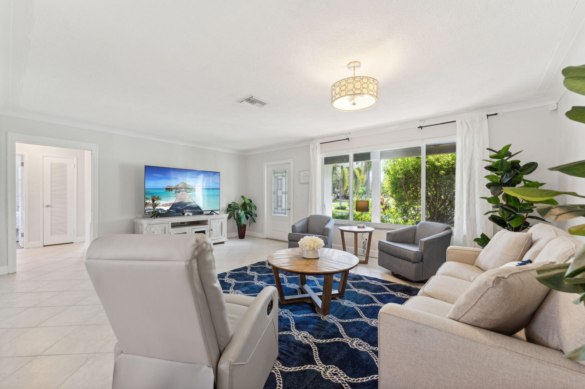 2691 Northeast 18th Street Pompano Beach, FL 33062 - Photo 5 of 34 a living room with furniture and a large window