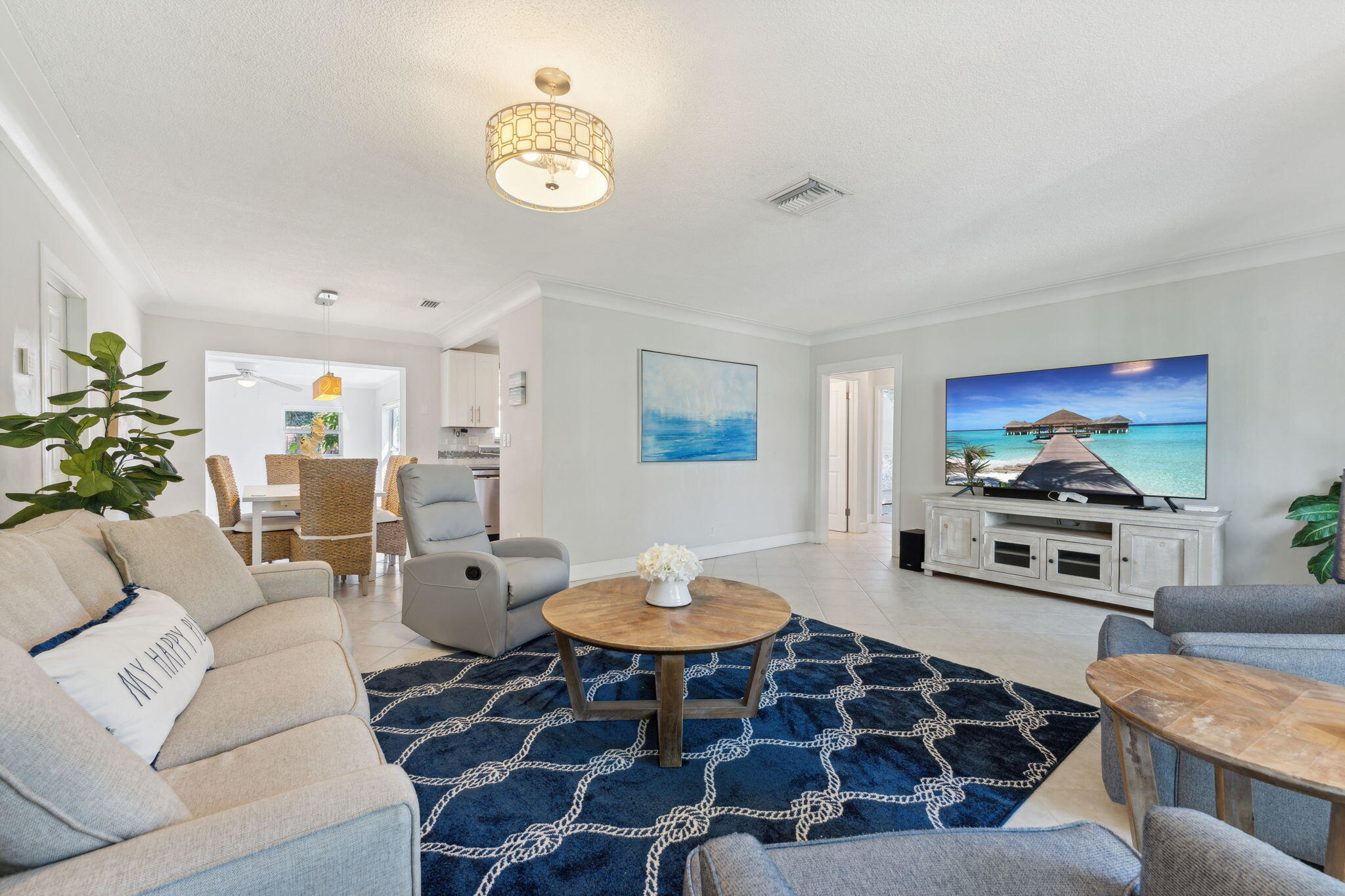 2691 Northeast 18th Street Pompano Beach, FL 33062 - Photo 6 of 34 a living room with furniture and a flat screen tv