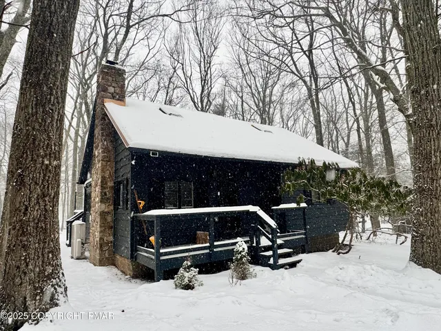 a view of outdoor space with seating and trees