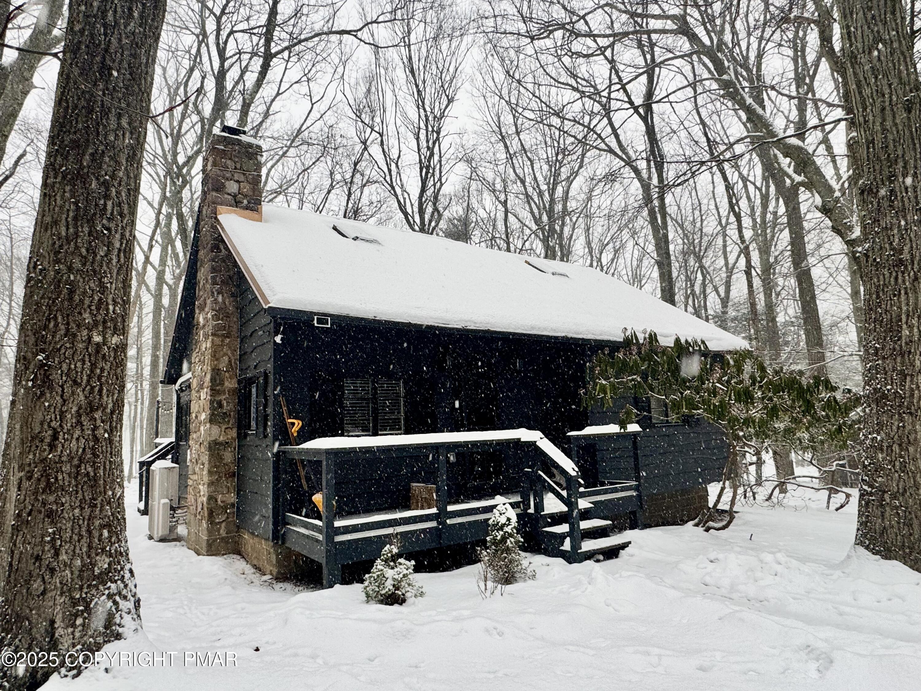 a view of outdoor space with seating and trees