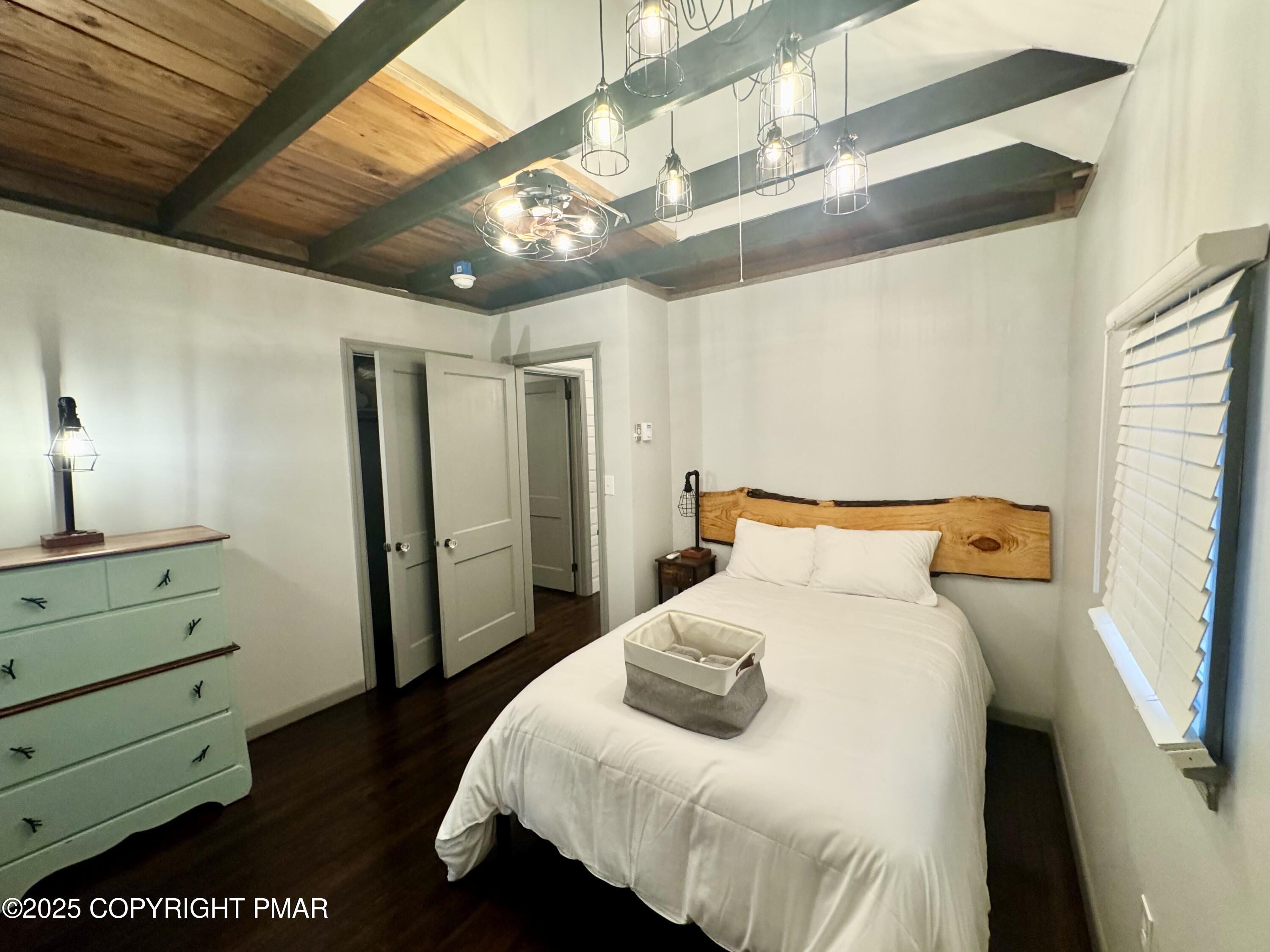 24 Split Rock Road Lake Harmony, PA 18624 - Photo 12 of 42 a bedroom with a bed and a mirror