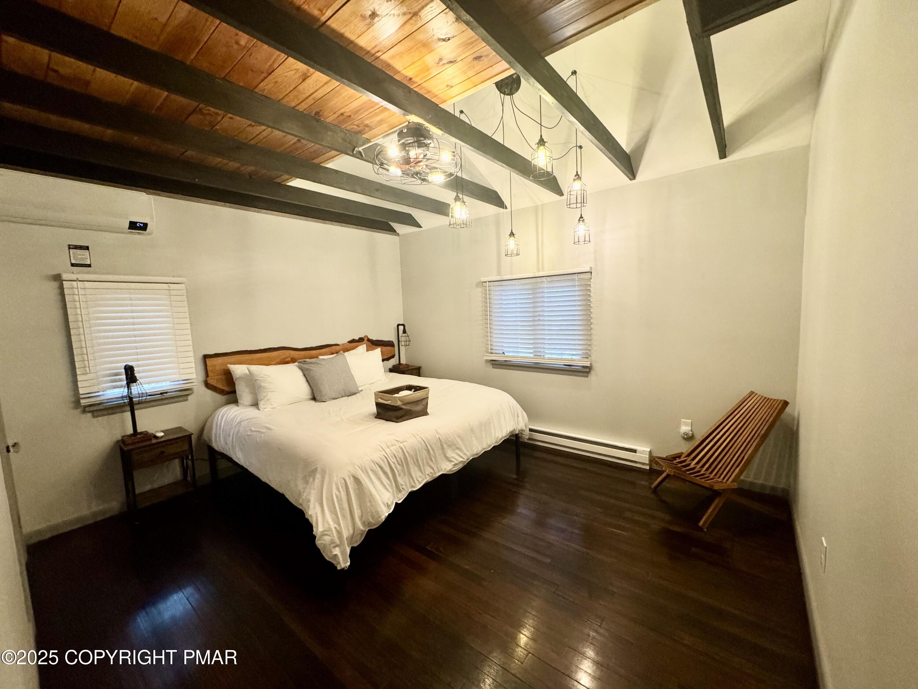 24 Split Rock Road Lake Harmony, PA 18624 - Photo 14 of 42 a bedroom with a bed and wooden floor