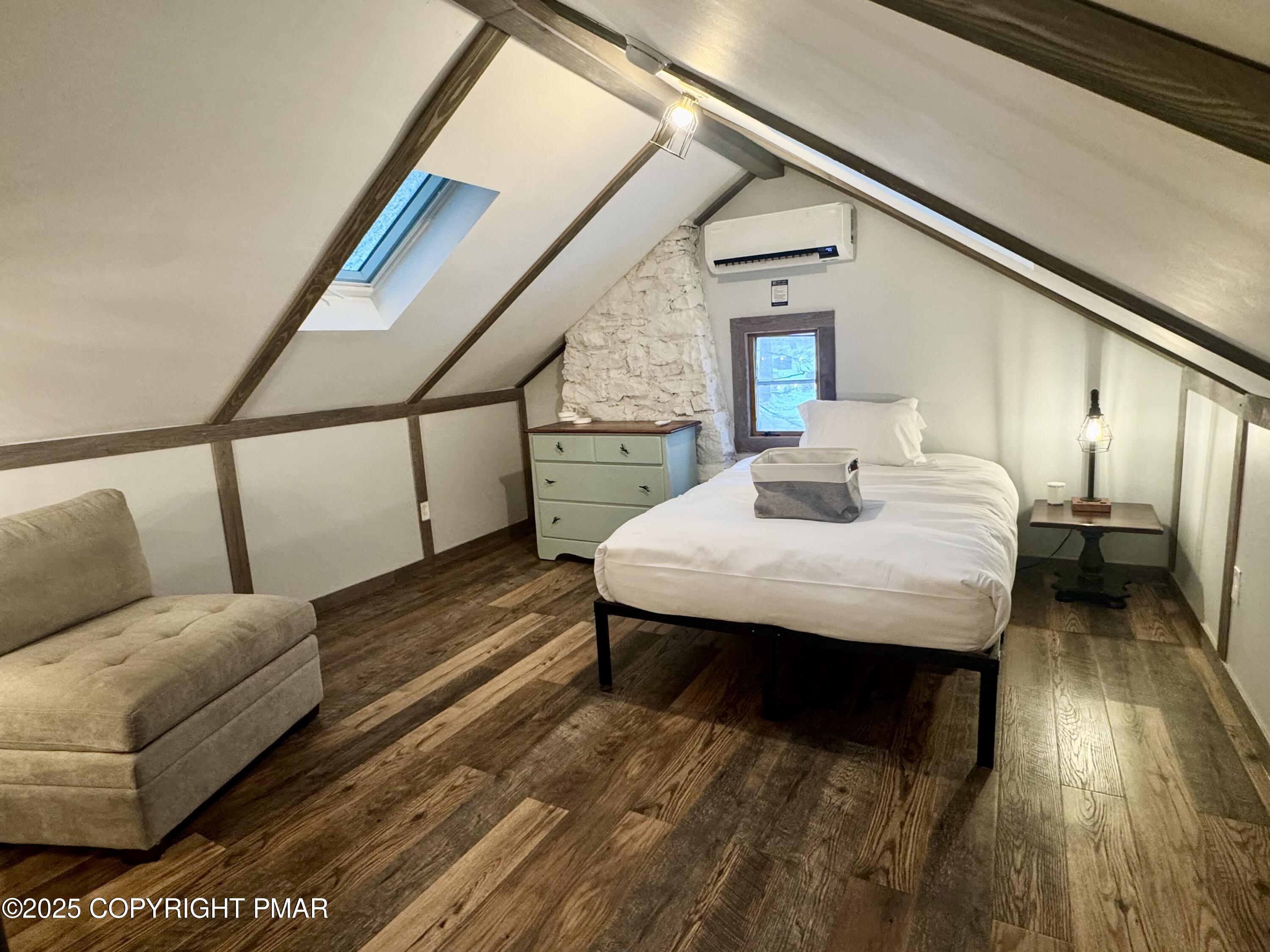 24 Split Rock Road Lake Harmony, PA 18624 - Photo 16 of 42 a living room with furniture and a wooden floor