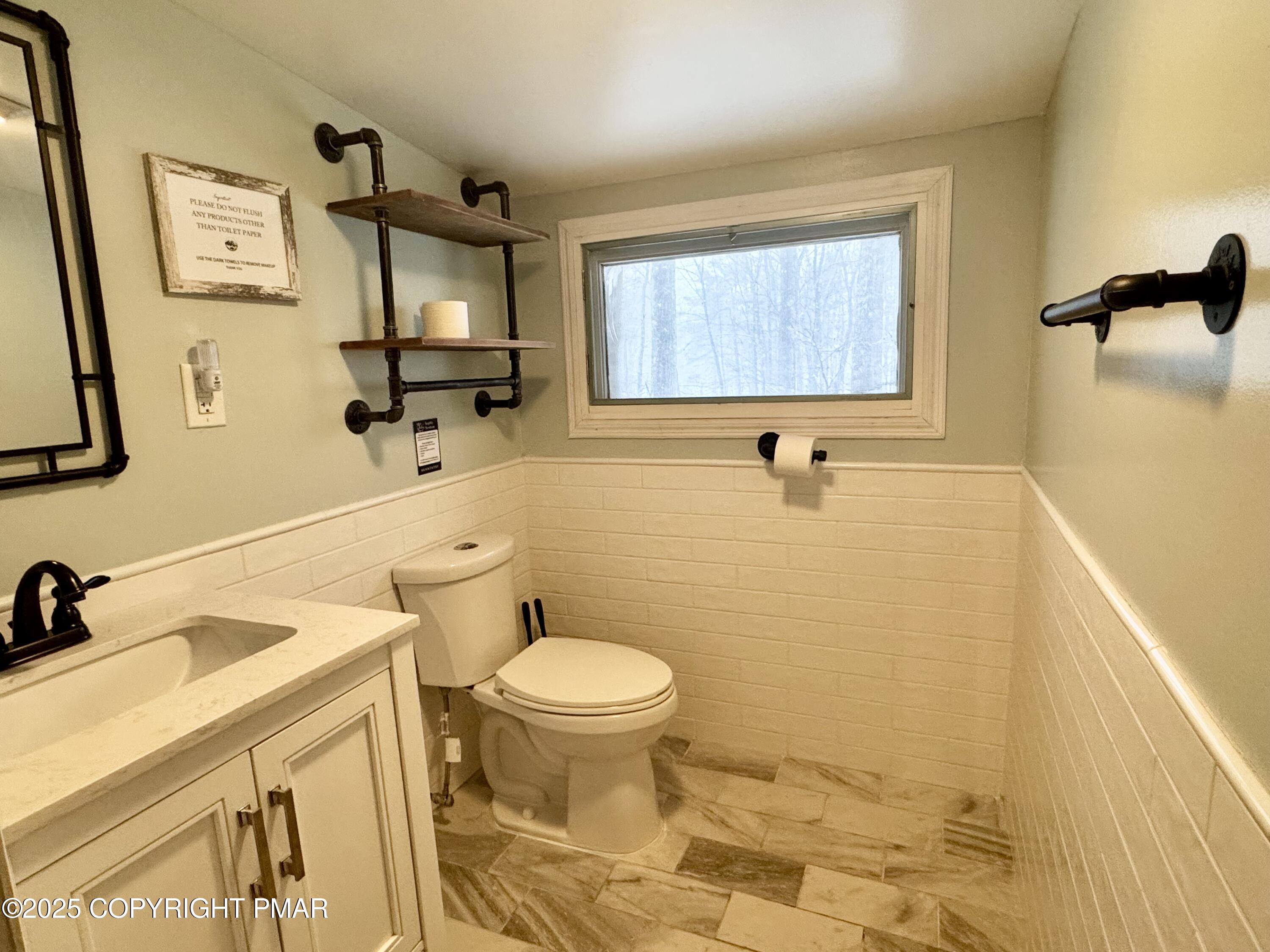 24 Split Rock Road Lake Harmony, PA 18624 - Photo 20 of 42 a bathroom with a sink and a toilet