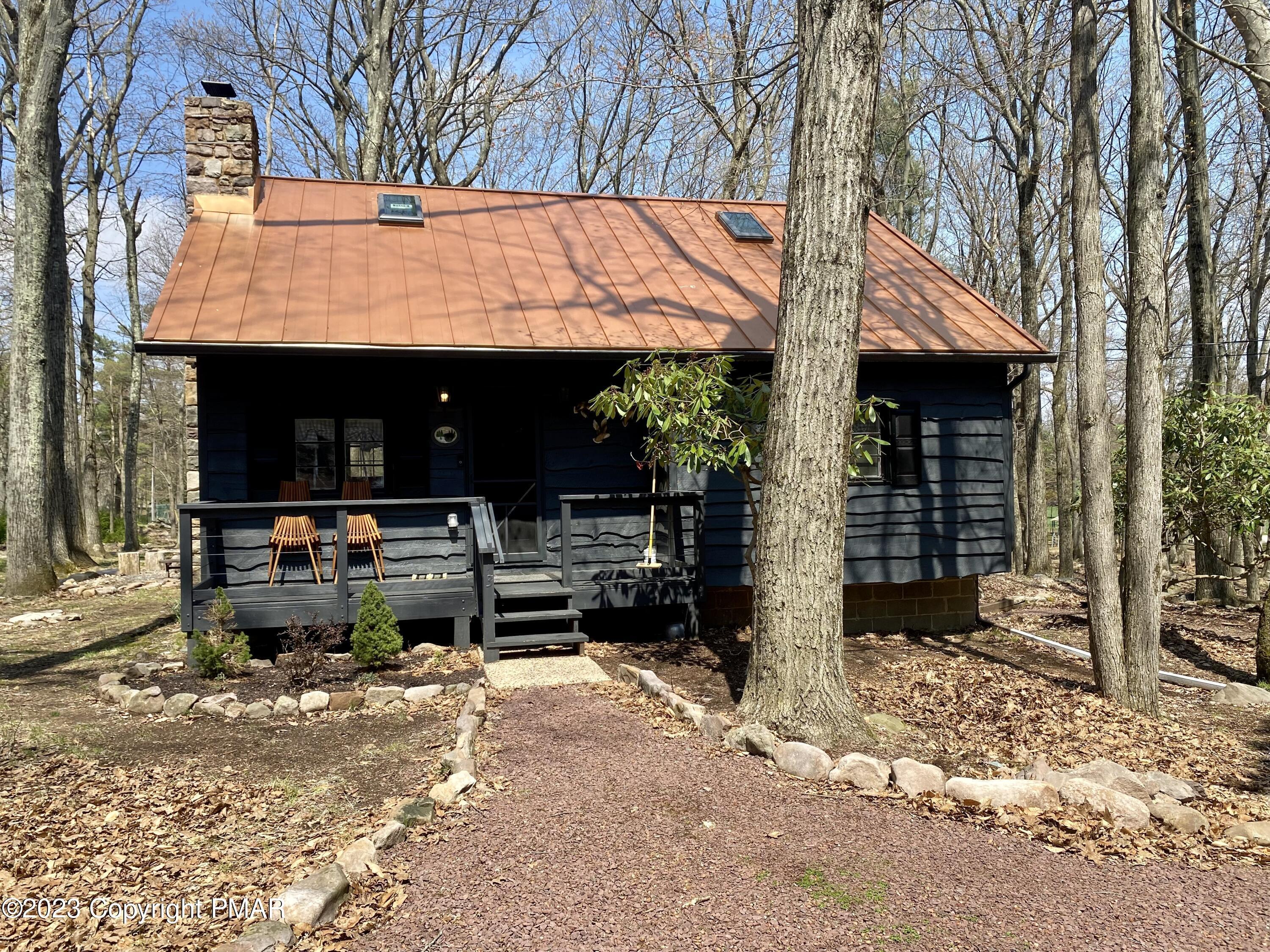 24 Split Rock Road Lake Harmony, PA 18624 - Photo 29 of 42 a view of a patio with table and chairs and potted plants