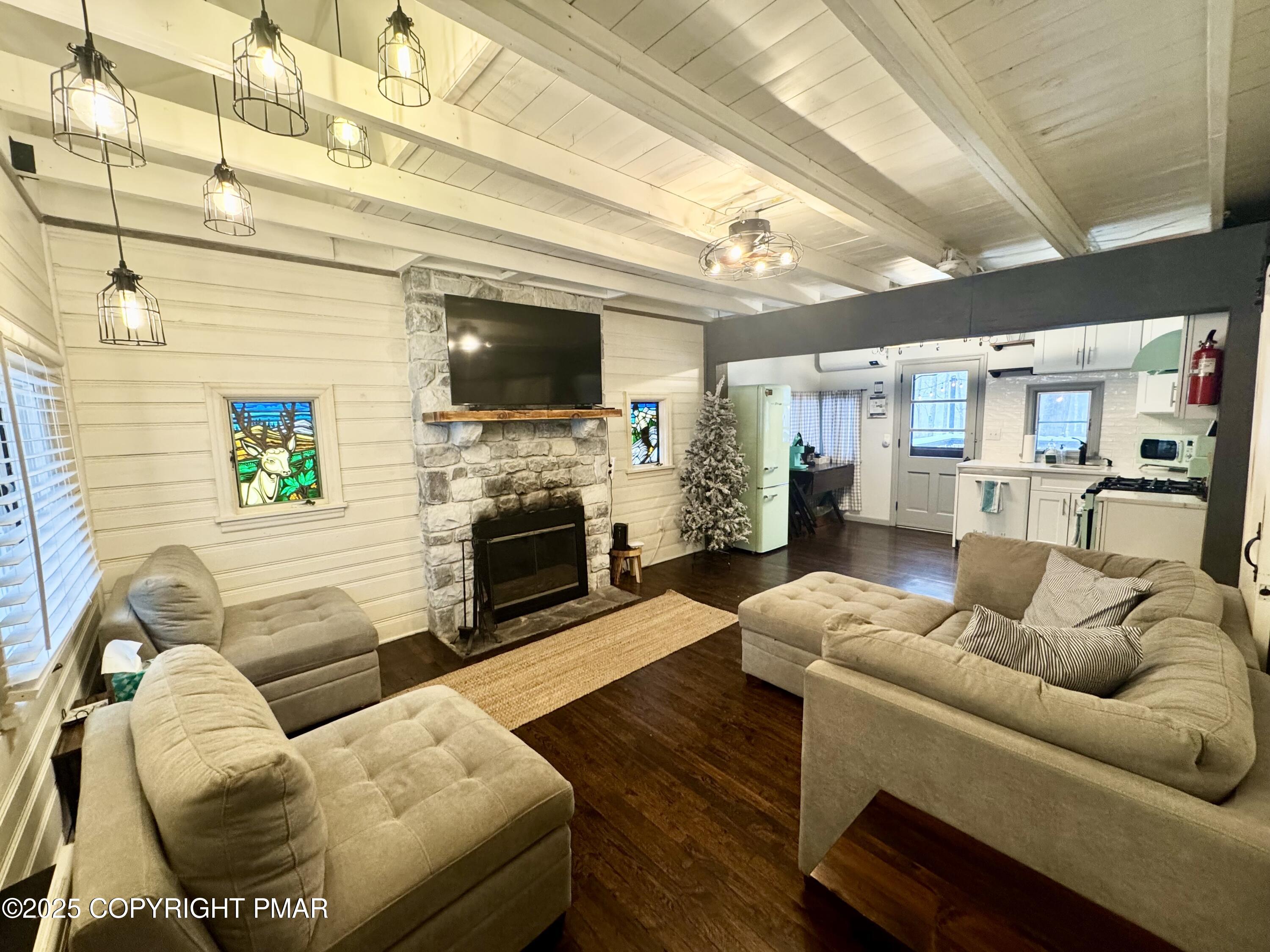 24 Split Rock Road Lake Harmony, PA 18624 - Photo 4 of 42 a living room with furniture and a fireplace