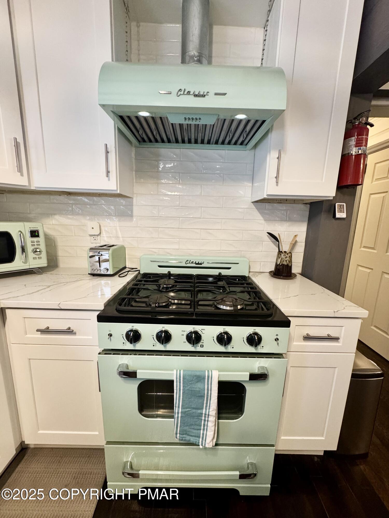 24 Split Rock Road Lake Harmony, PA 18624 - Photo 10 of 42 a stove top oven sitting inside of a kitchen