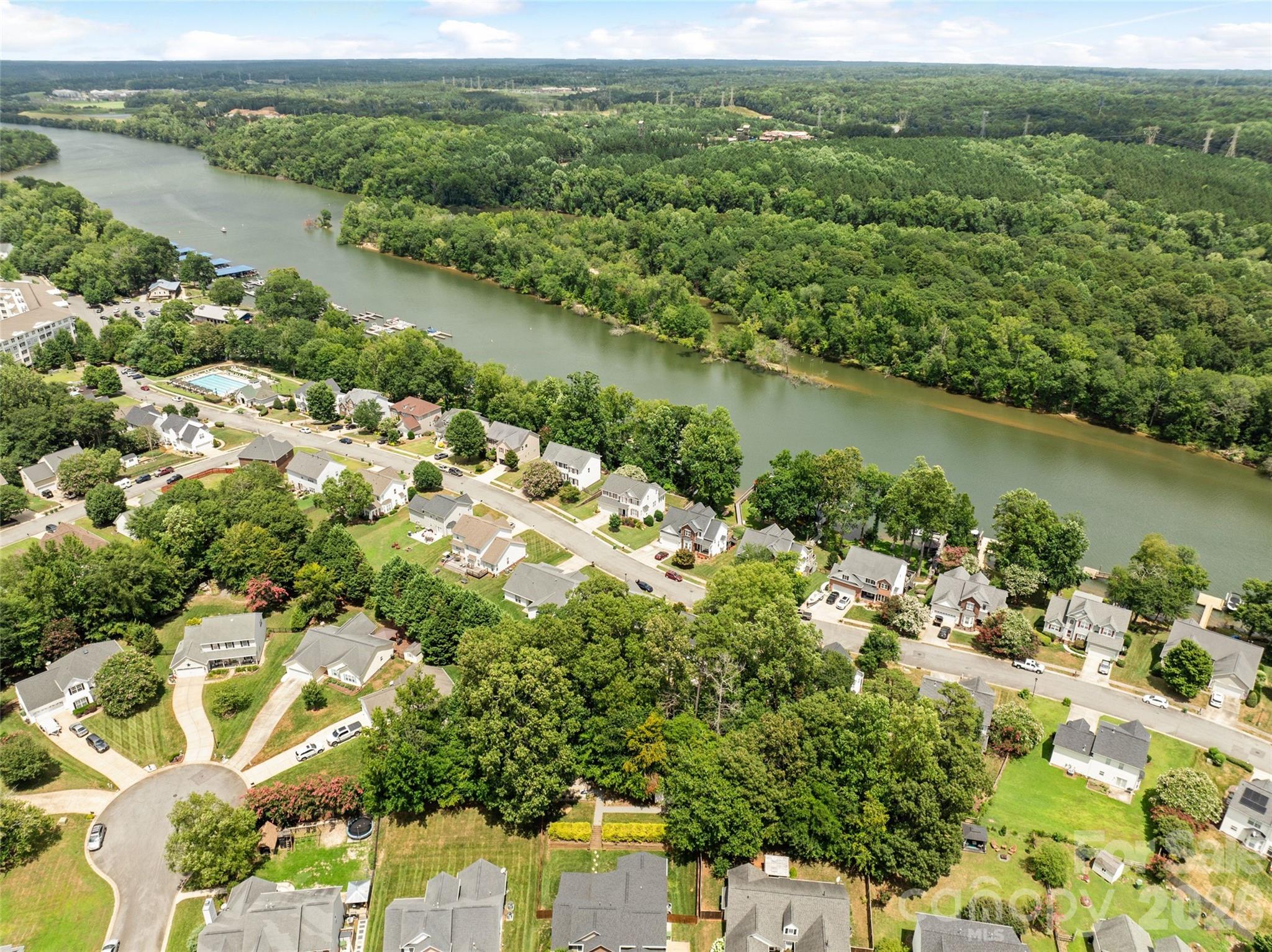 152 Lighthouse Road Mount Holly, NC 28120 - Photo 10 of 11 an aerial view of a houses with a lake view