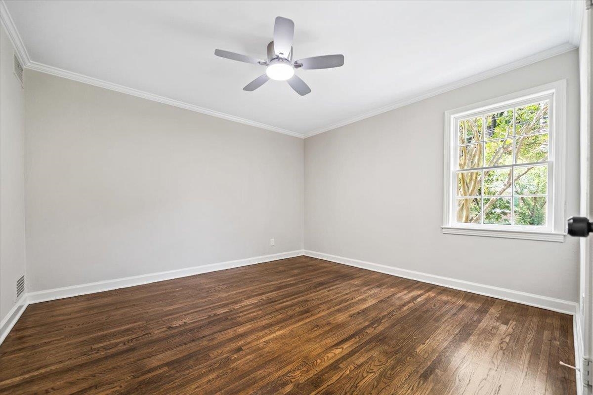 170 South Greer Street Memphis, TN 38111 - Photo 17 of 35 Hardwood flooring, crown molding, and a ceiling fan with integrated lighting
