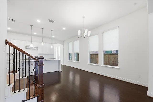 a view of an entryway with wooden floor