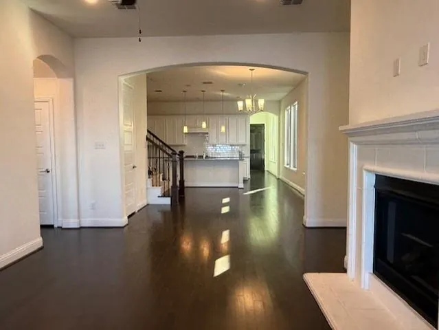 a view of a living room with a fireplace
